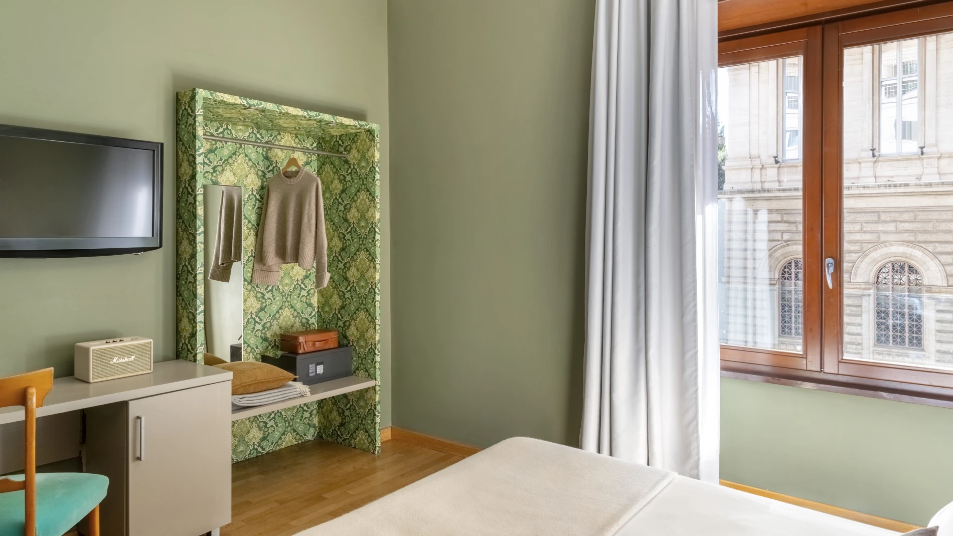 Standard room with desk, wall-mounted TV and open wardrobe, modern design with urban view in Monti district Rome - Monti First, BZAR hotels in Rome
