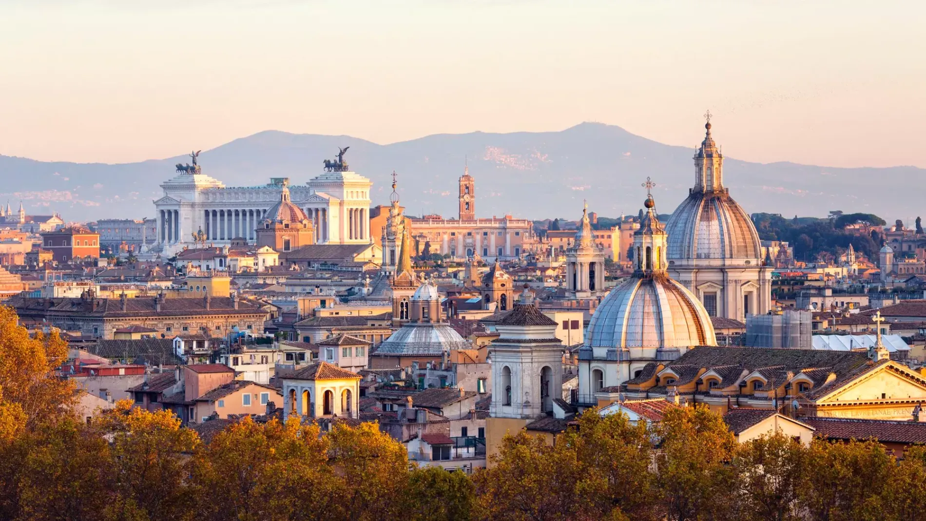 Rome skyline at sunset with domes, historic landmarks and Altare della Patria, scenic view near Monti district - Monti First, BZAR hotels in Rome