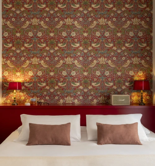 Elegant small room with red headboard, decorative wallpaper and warm lighting, in the heart of Monti district in Rome - Monti First, BZAR hotels in Rome