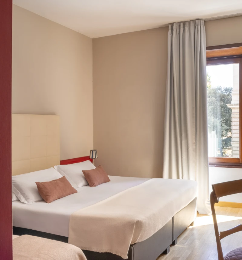 Bright triple room with double and single bed, window overlooking historic building in Monti district Rome - Monti First, BZAR hotels in Rome